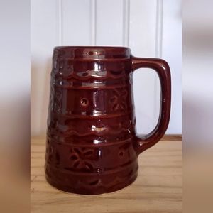 Brown Glazed Ceramic Mug with Decorative Relief